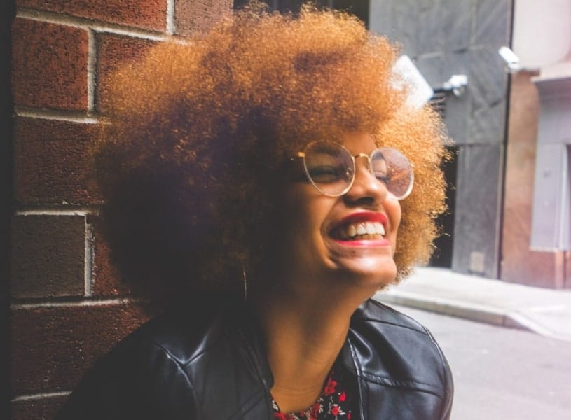 woman smiling and wearing lipstick